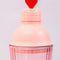 up close of pink bar shaker with red heart on the lid