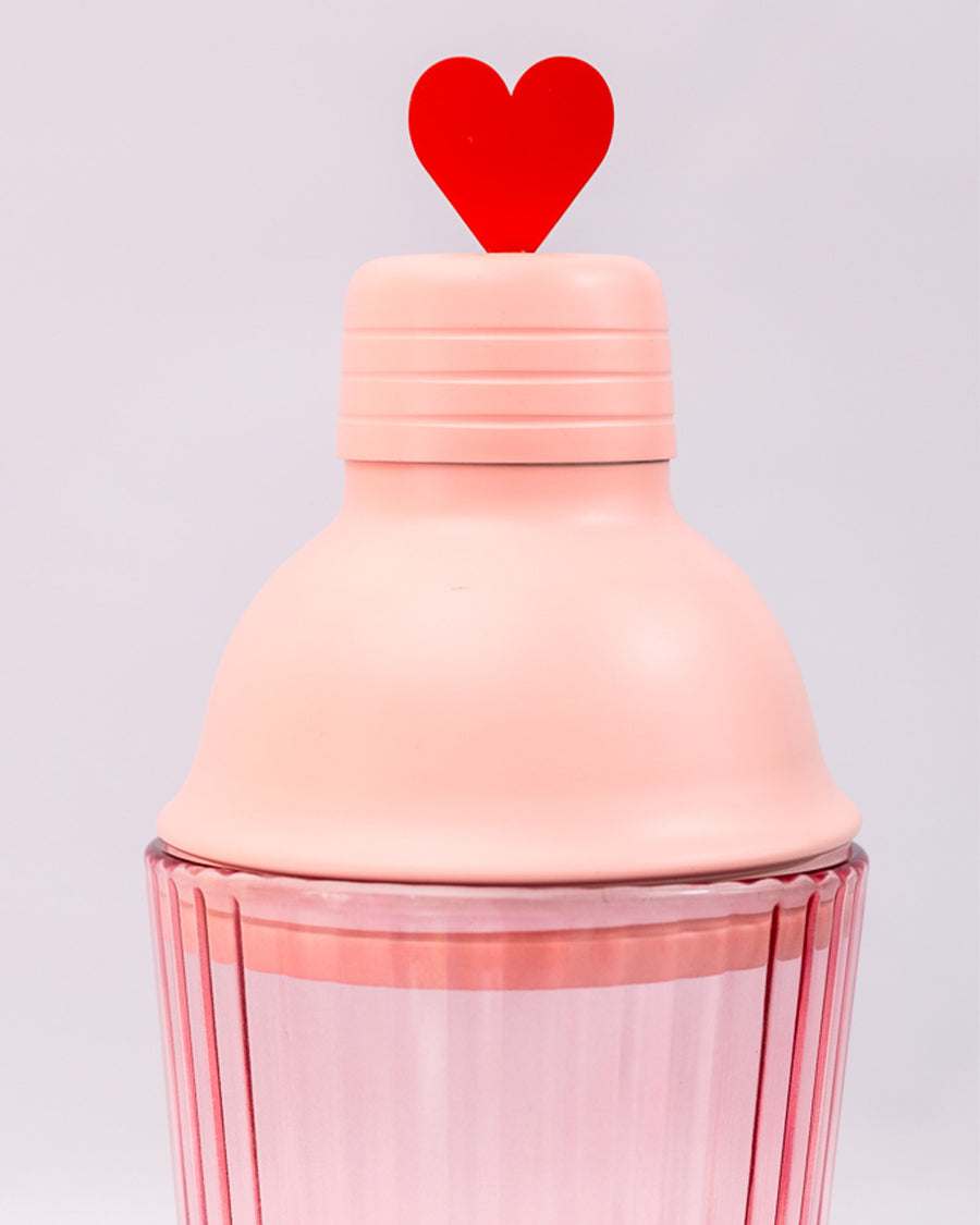 up close of pink bar shaker with red heart on the lid