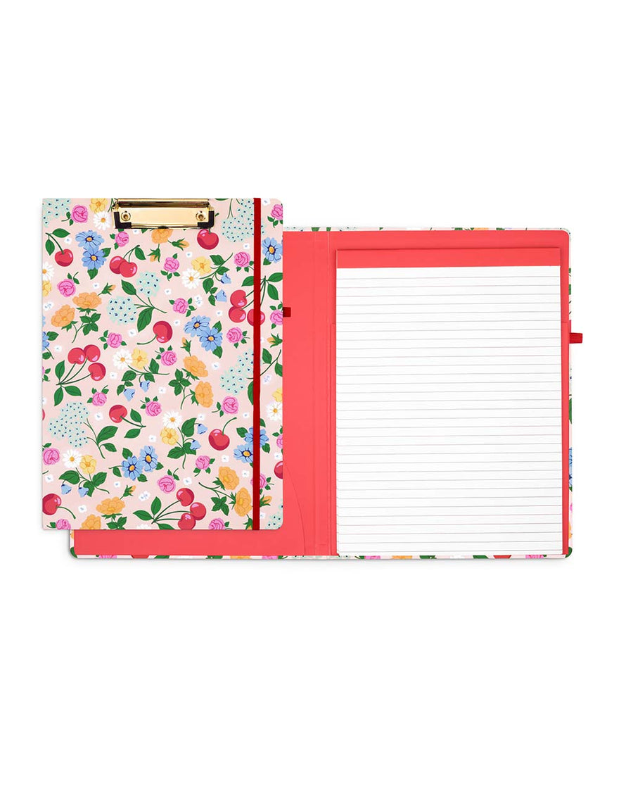 red interior and cover of light pink clipboard folio with cherry and assorted floral print