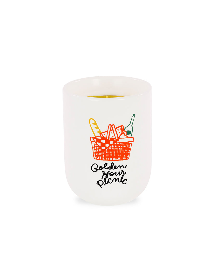 strawberry and berries scented candle with 'golden hour picnic' and picnic image on the front