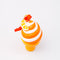 top view of ceramic orange and white swirled ice cream cone ornament