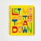 yellow large planner with colorful 'let me write that down' across the front