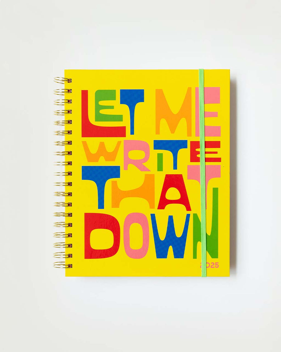 yellow large planner with colorful 'let me write that down' across the front