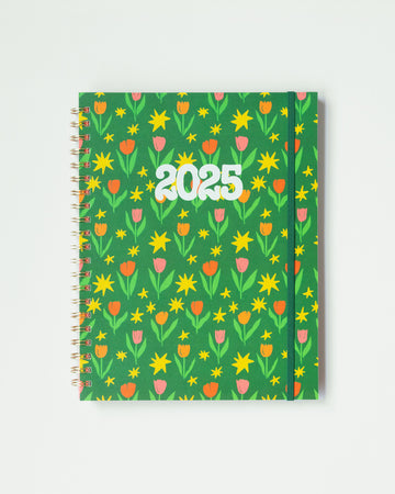 green soft cover 12 month planner with pink, red and orange abstract tulip print