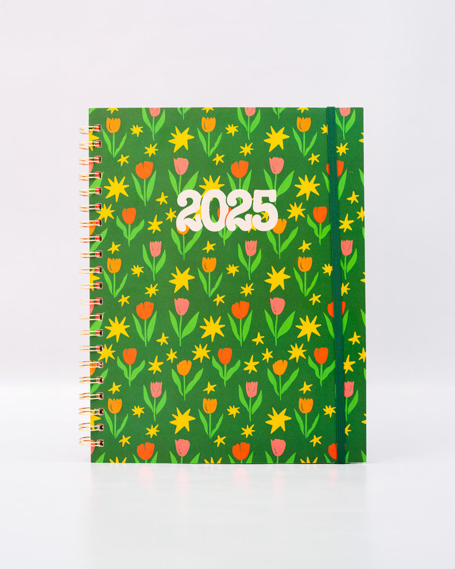 green soft cover 12 month planner with pink, red and orange abstract tulip print