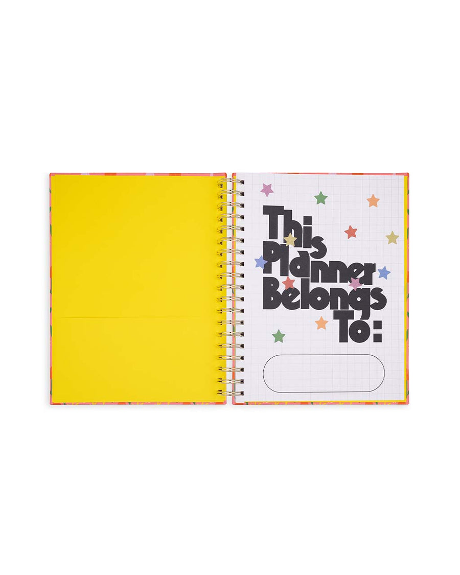 interior yellow pocket with 'this planner belongs to: 