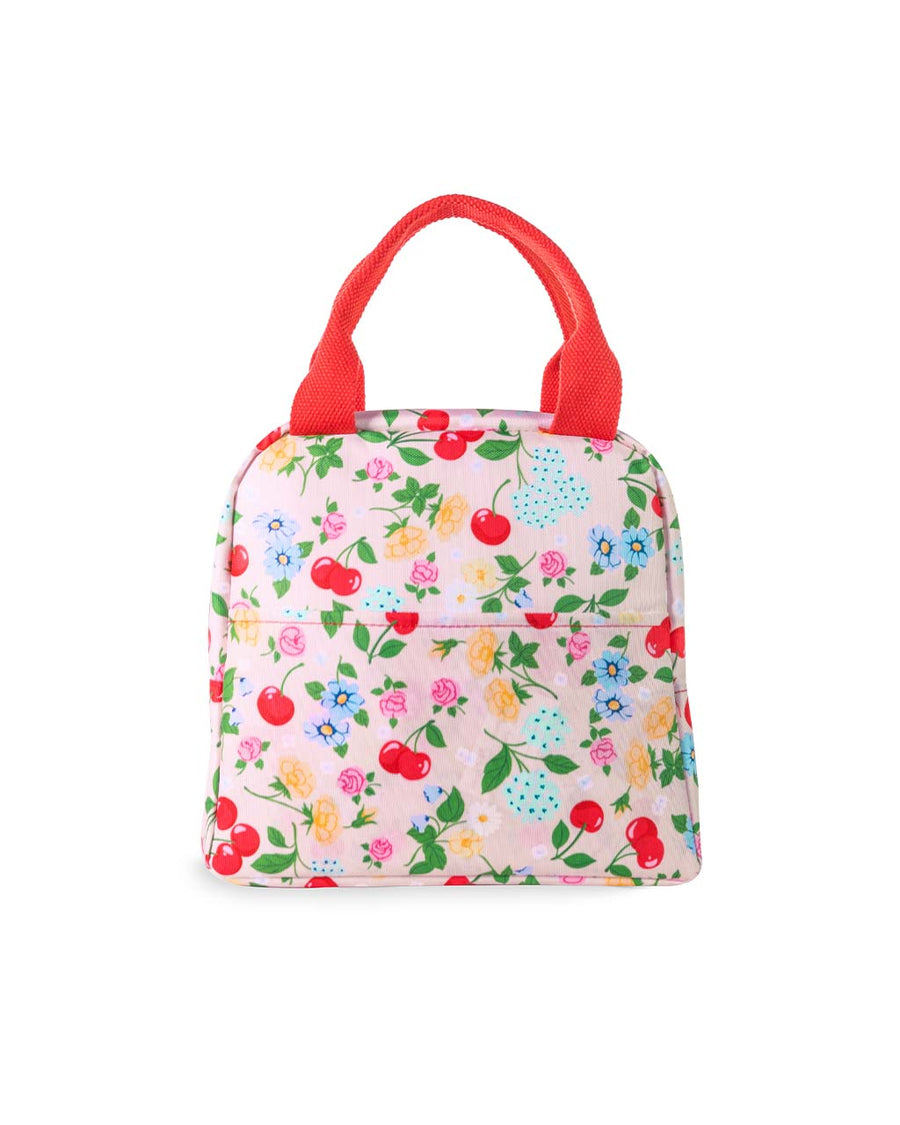 back view of light pink lunch tote with all over cherry and flower print and red handles