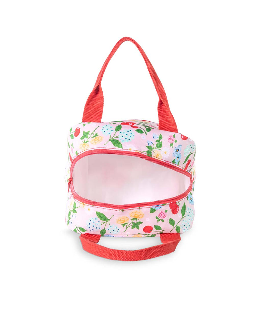 interior of light pink lunch tote with all over cherry and flower print and red handles