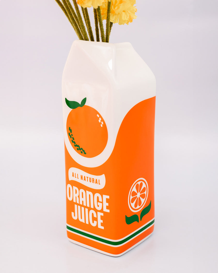 up close of Porcelain orange juice carton-shaped vase