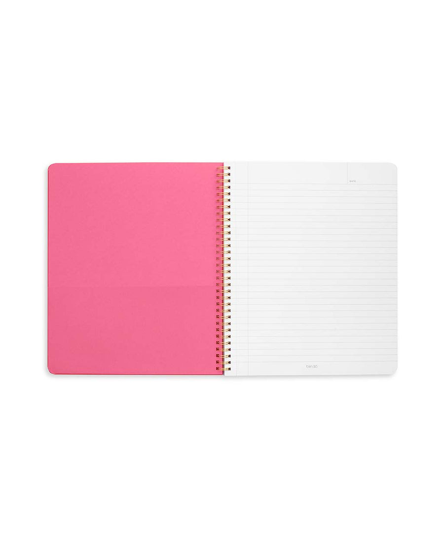 pink interior pocket and lined paper of pink large notebook with white 'it's all leading to something' typography across the front