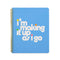 blue large notebook with white 'i'm making it up as i go' across the front