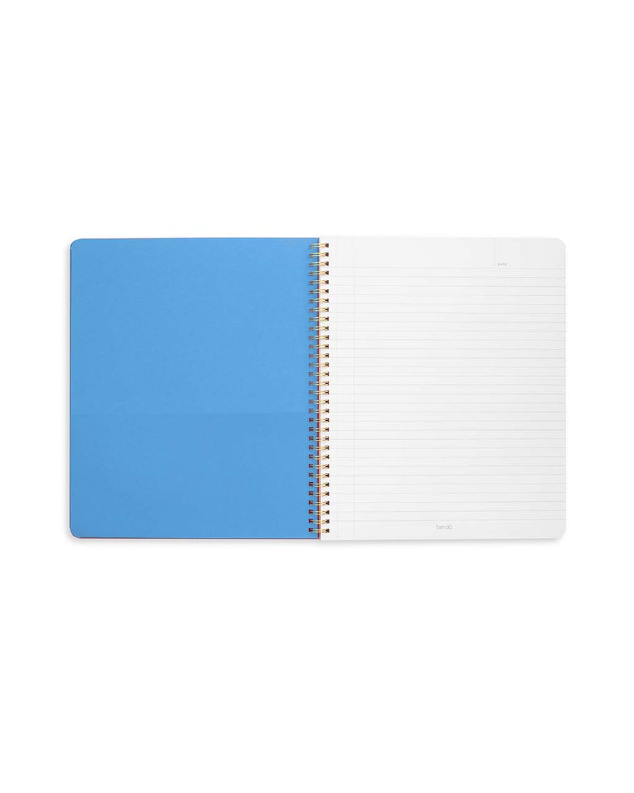 blue pocket and interior pages of large notebook