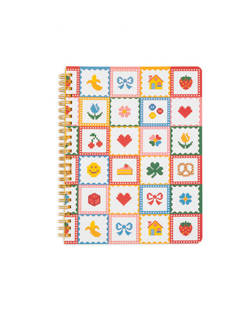 white mini notebook with colorful patchwork design