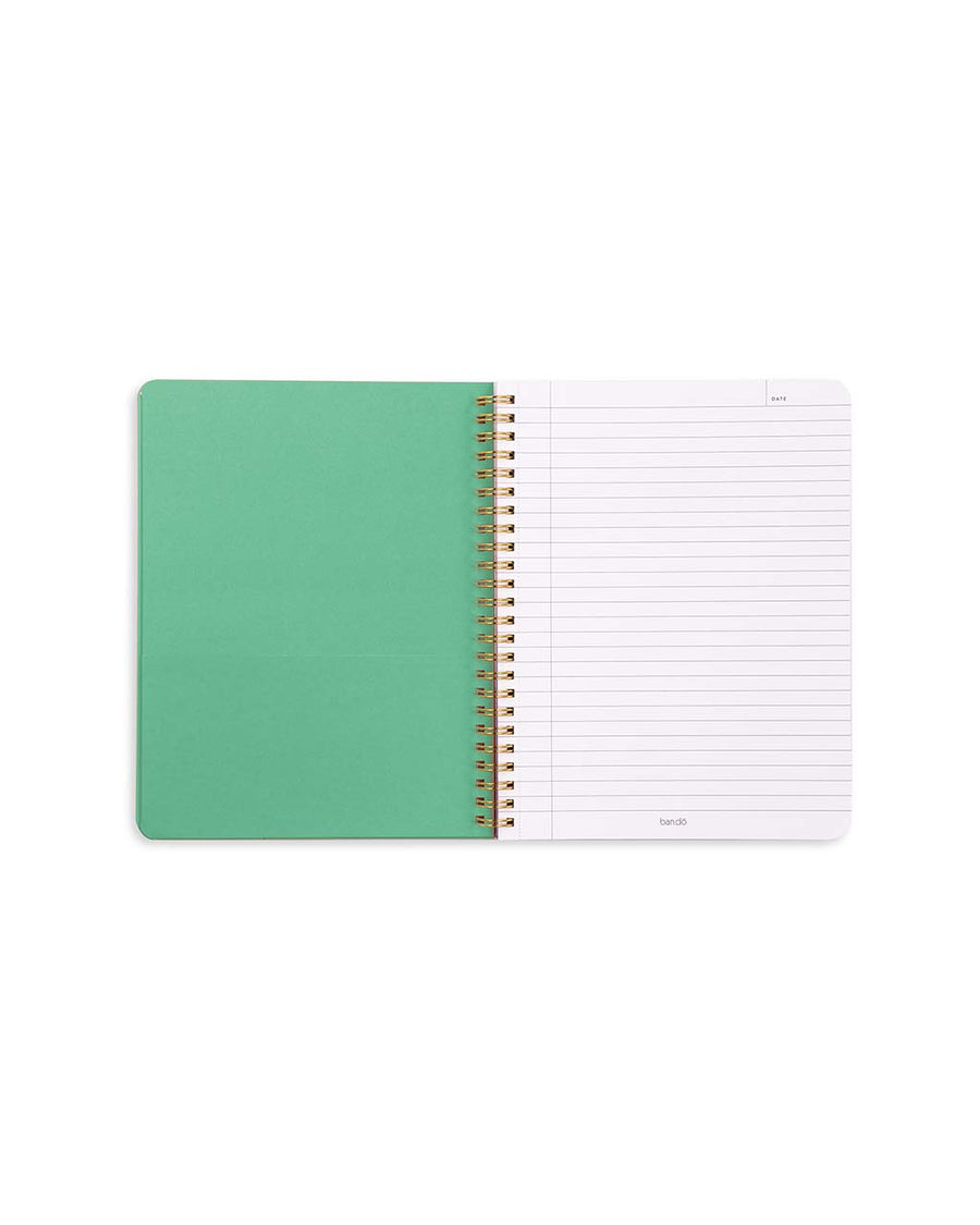 green pocket and lined paper of light pink mini notebook with all over strawberry print