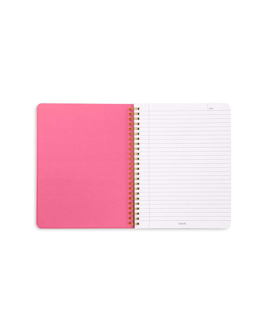 pink pocket and lined pages of baby blue mini notebook with rainbow 'smile' typography across the front