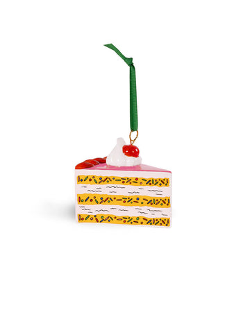 ceramic cake slice shaped ornament with sprinkle center and cherry and whipped topping on top