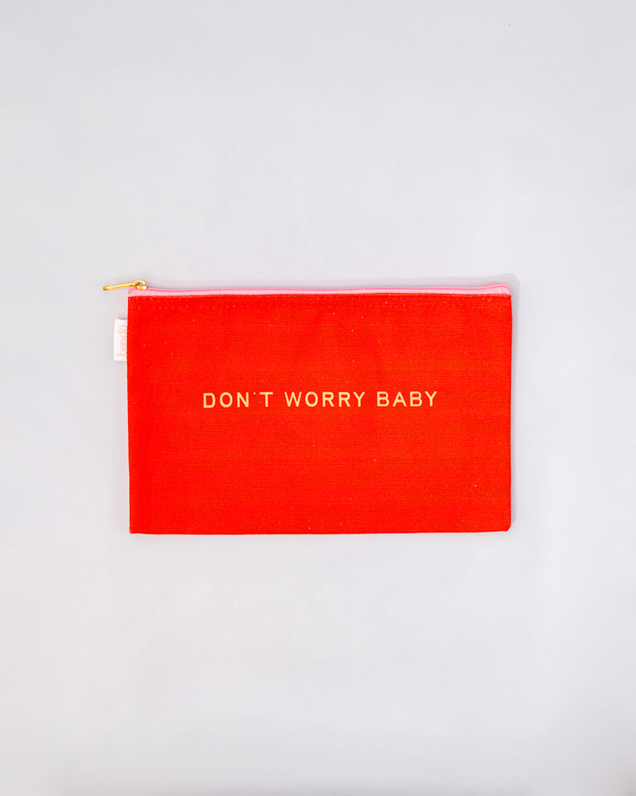 small red pouch with gold 'don't worry baby' across the center