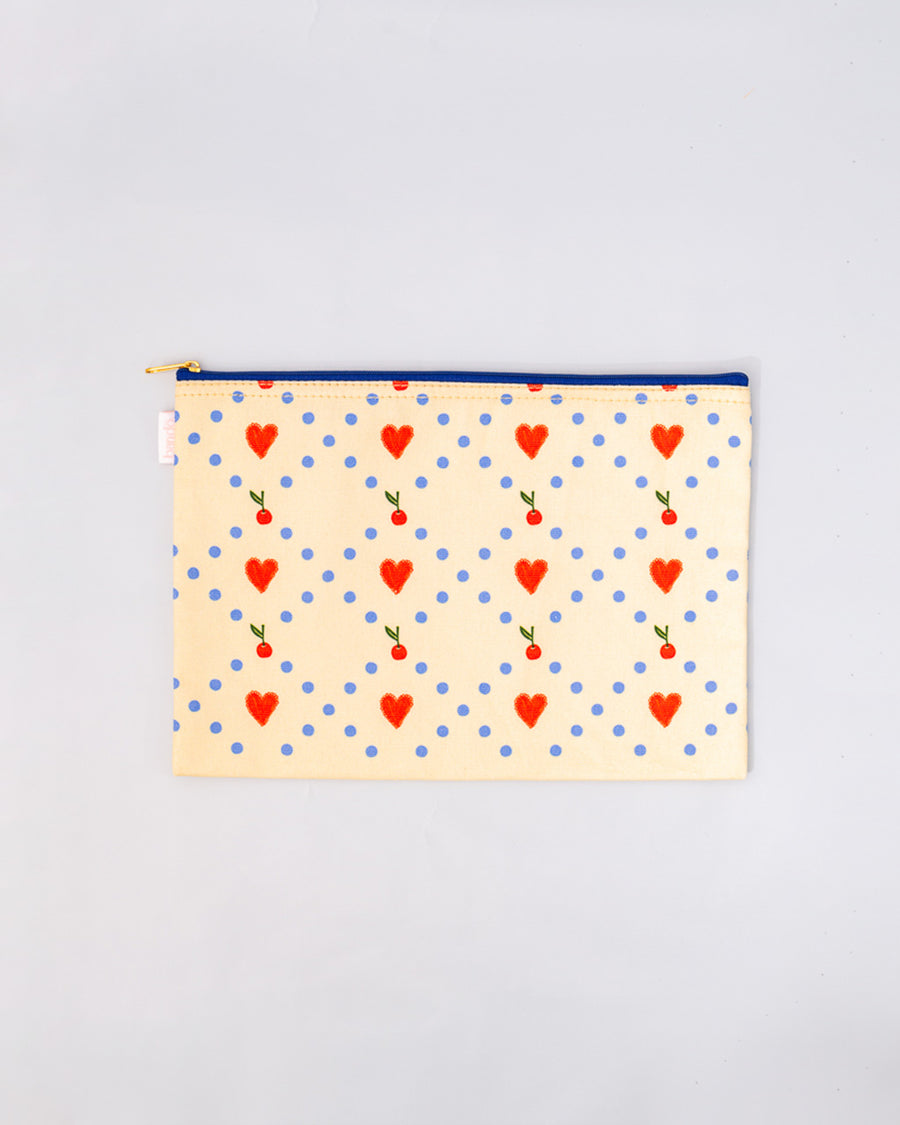 cream medium pouch with drawn heart and cherry print with blue zipper trim