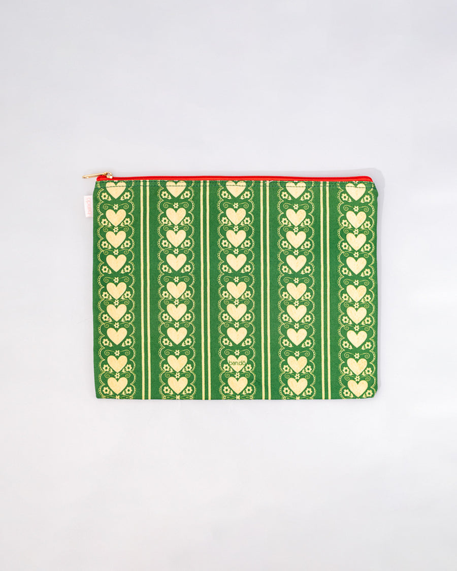 large pouch with green ground and cream heart stripe print with red zipper trim