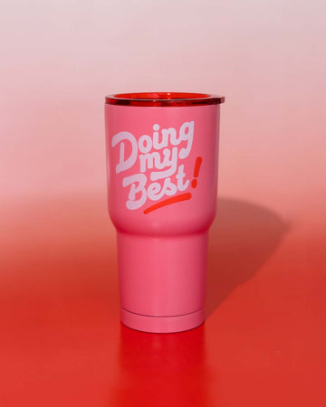 pink steel tumbler with pink lid and white 'doing my best' across the front on red and white gradient background