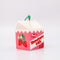 side view of ceramic strawberry milk carton ornament