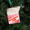 ceramic strawberry milk carton ornament in a tree