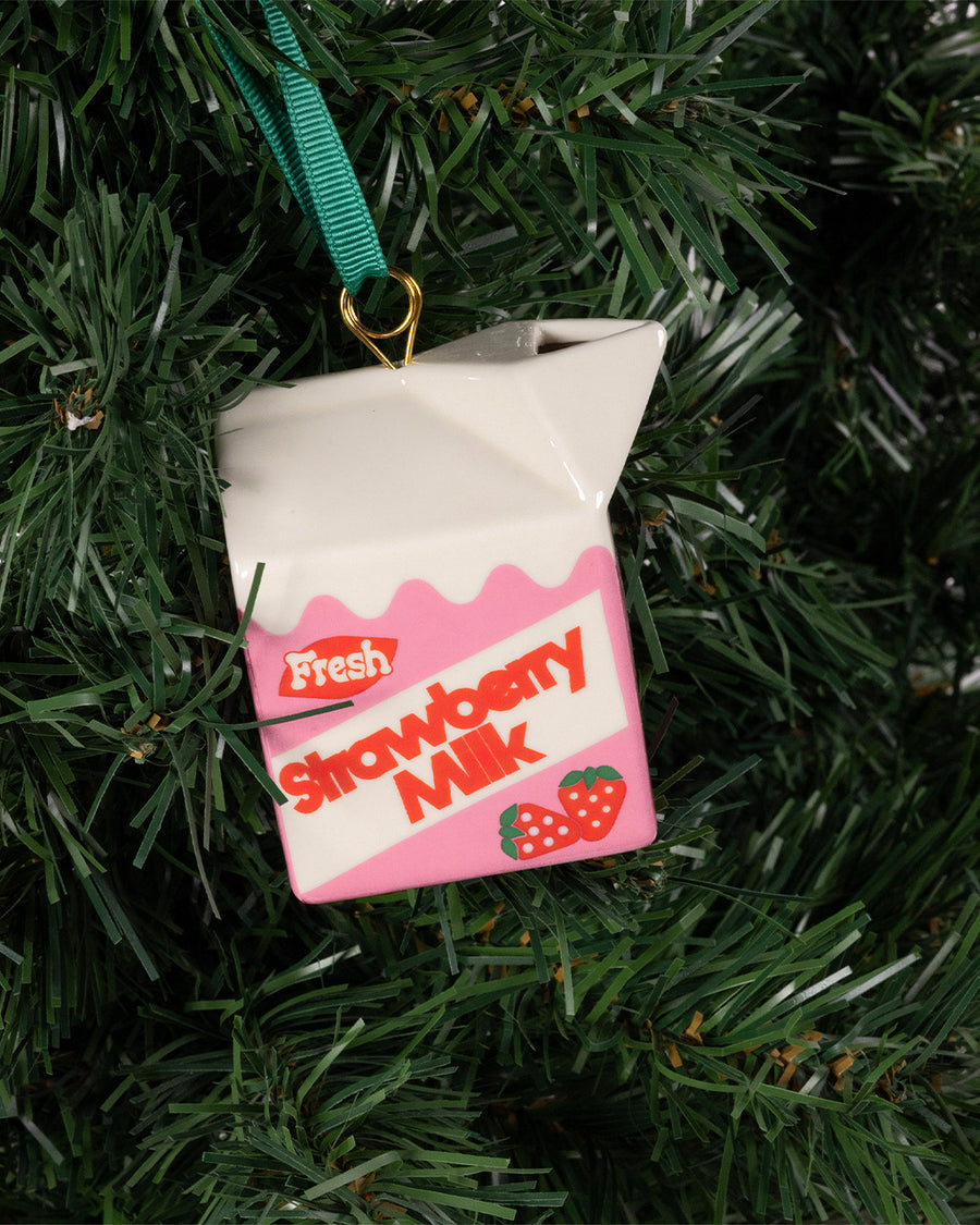 ceramic strawberry milk carton ornament in a tree