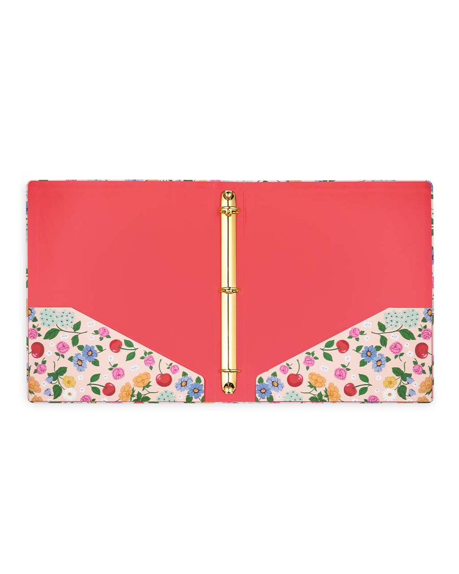 red interior of light pink three ring binder with cherry and floral print