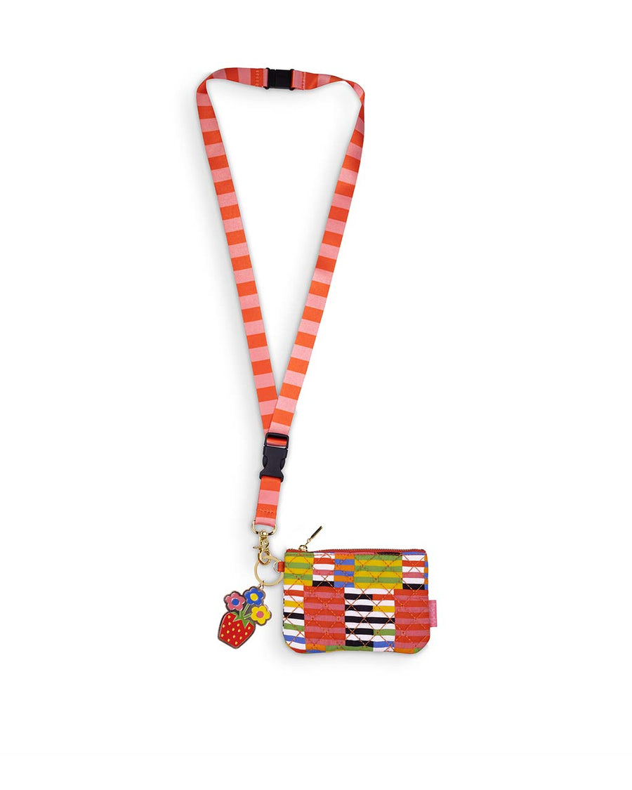 colorful, black and white stripe quilted pouch with strawberry floral keychain and pink striped breakaway lanyard