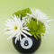 8 ball shaped vase with white and green flowers