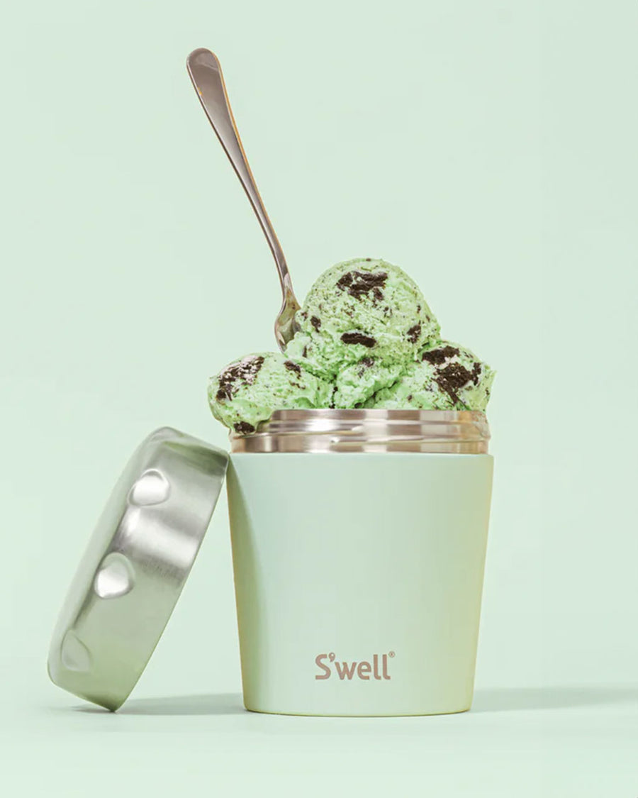 mint ice cream chiller with silver lid with ice cream and spoon