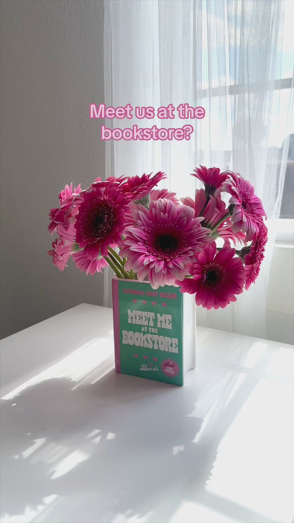 showcasing the meet me in the bookstore book shaped vase