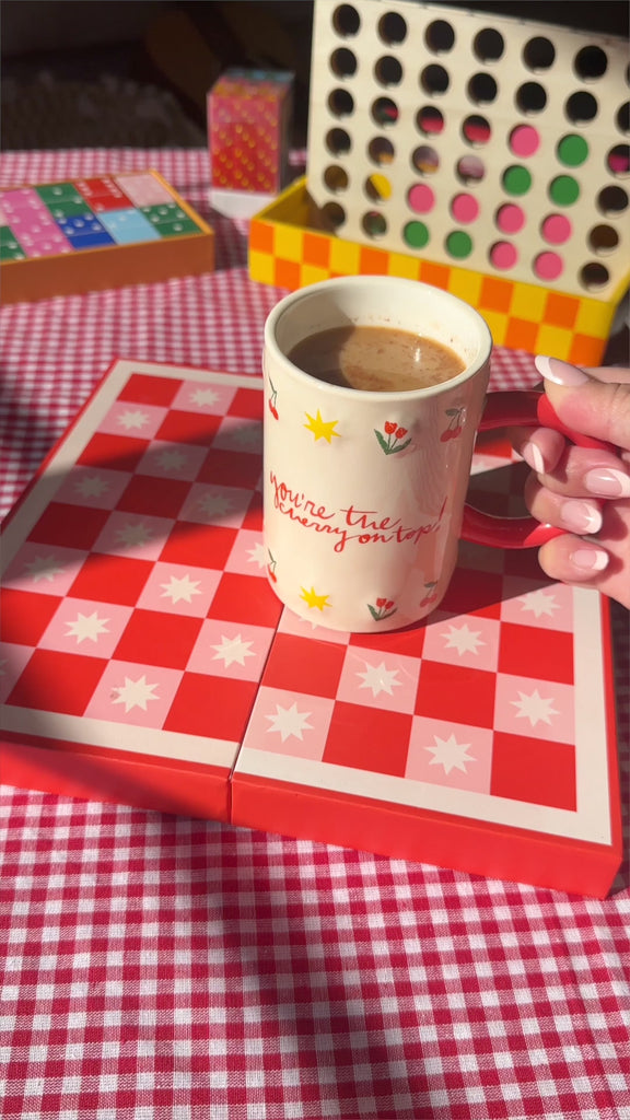 model filling cherry on top mug with a delicious beverage