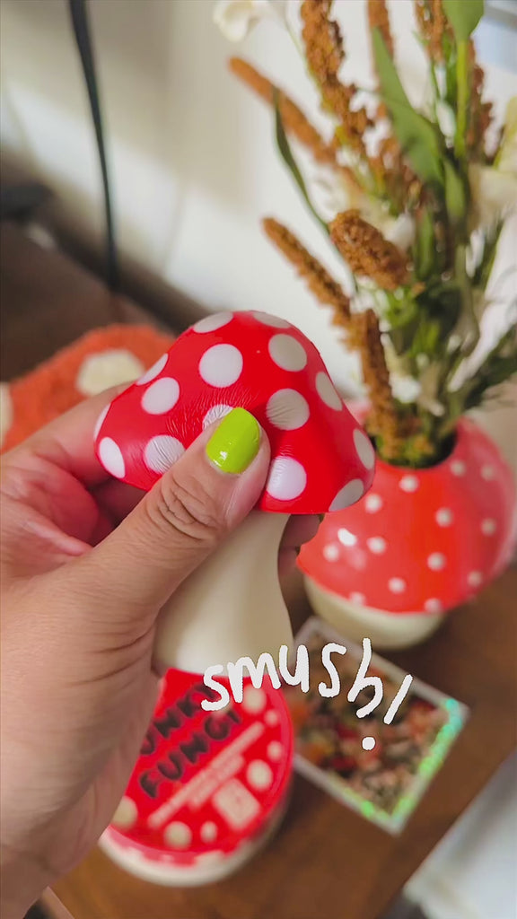 model squishing mushroom shaped de-stress ball