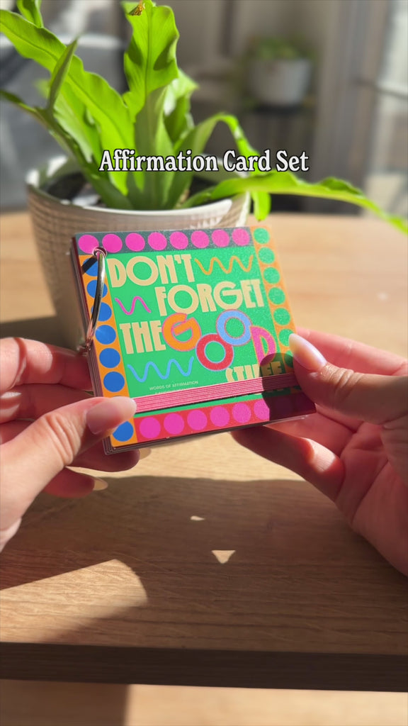 model flipping through 'don't forget the good' affirmation card set