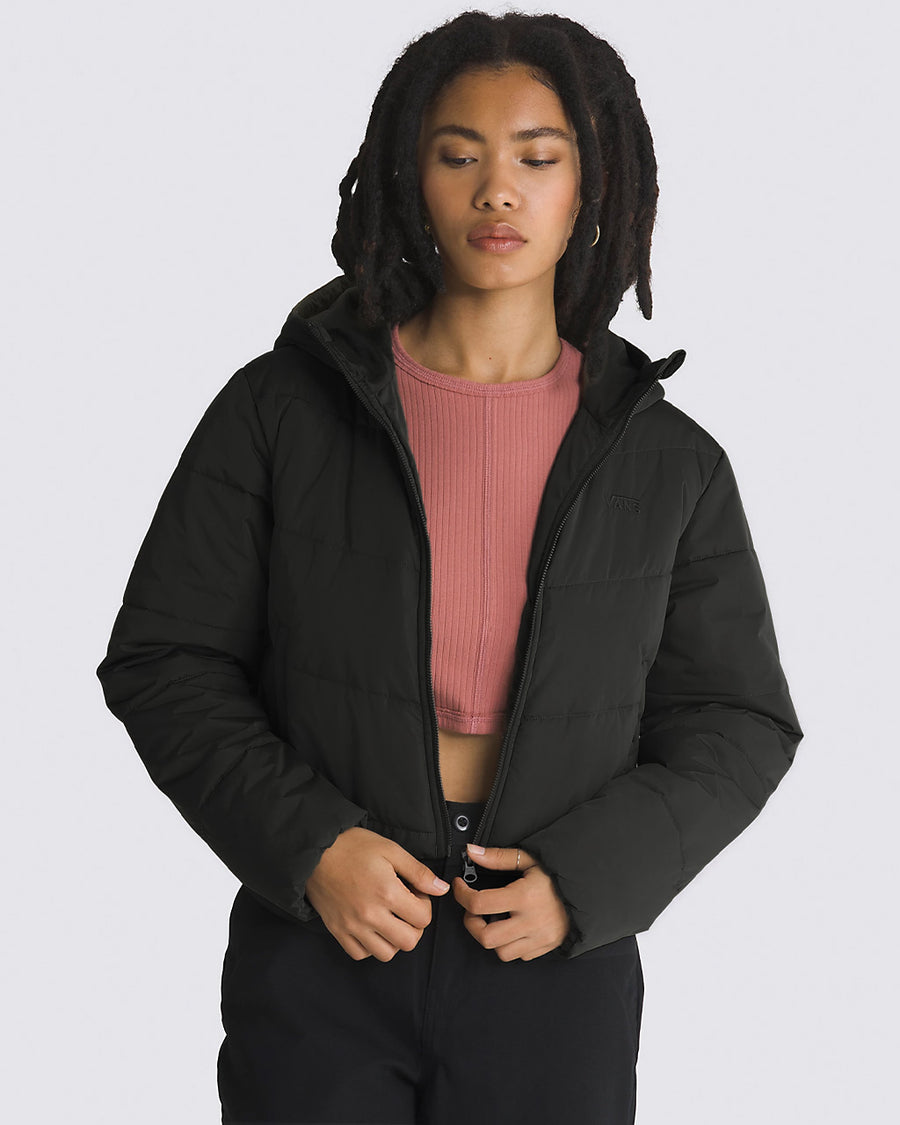 model wearing black cropped puffer jacket with a hood