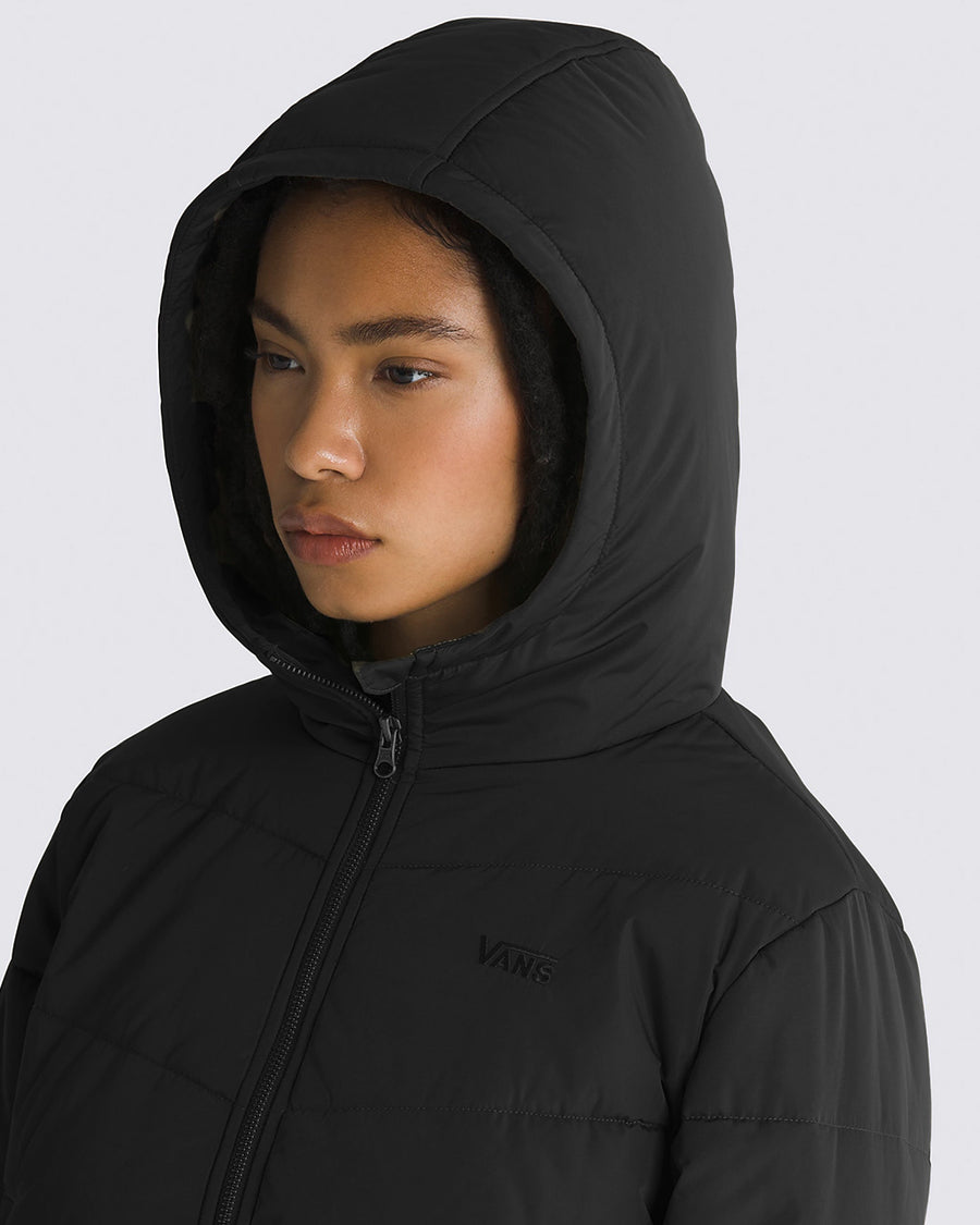 model wearing hood up on black puffer hooded cropped jacket