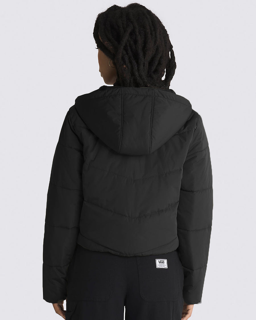 back view of model wearing black cropped puffer jacket with a hood