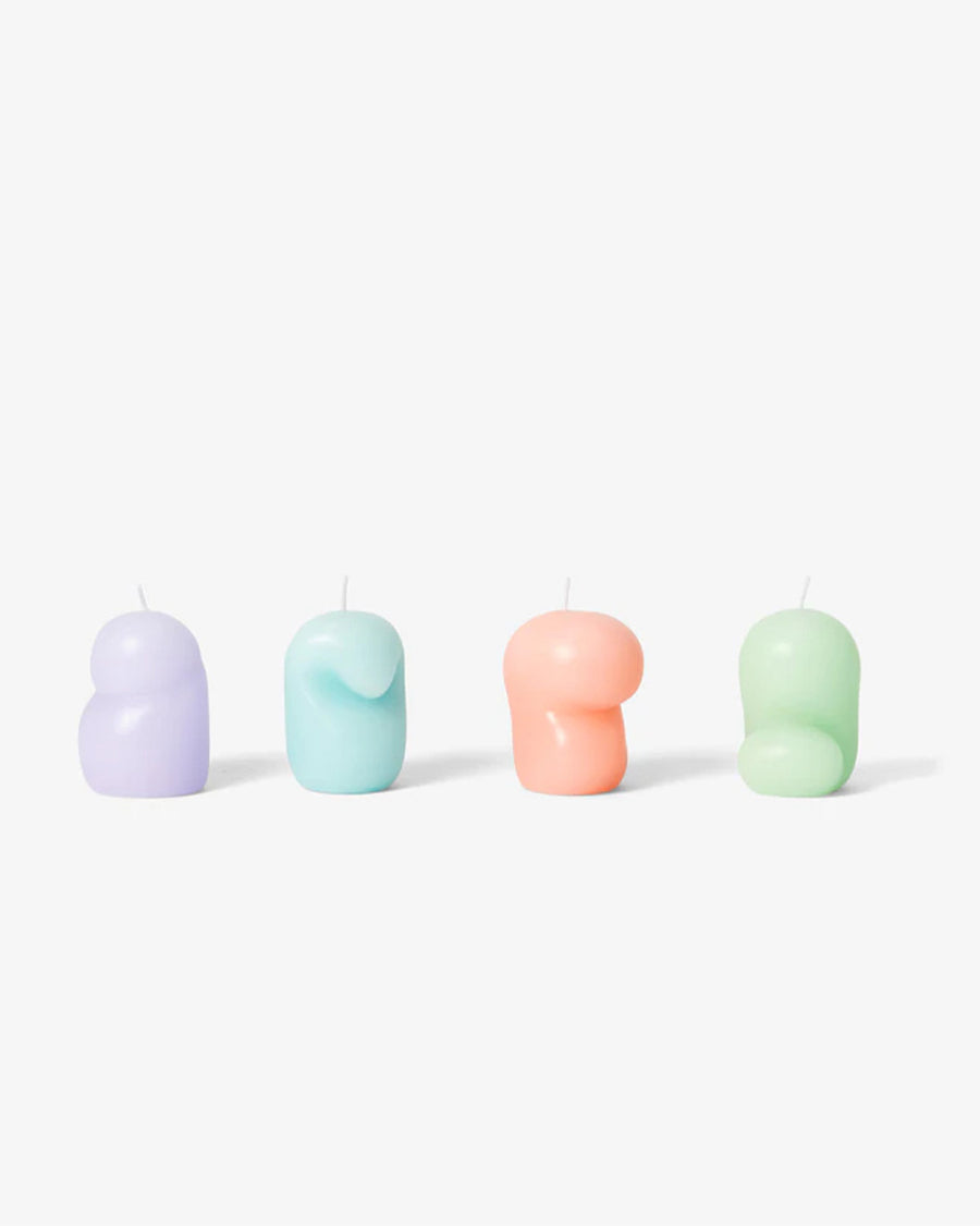 set of four goober mini candles in purple, blue, coral and green