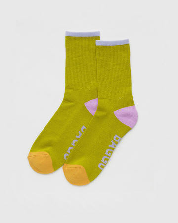 Knee socks in lilac on ocher yellow