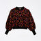 black ikat leopard sweater with multicolored pearl embellishments