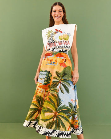 model wearing vibrant beach scene skirt and copacabana muscle tee