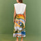 backview of model wearing vibrant beach scene skirt and copacabana muscle tee