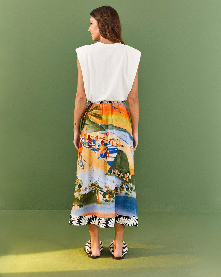 backview of model wearing vibrant beach scene skirt and copacabana muscle tee