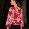 backview of model wearing pink cropped sweater with all over sequins and graphic heart print