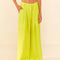 model wearing lime green linen pants with wide legs