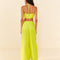 backview of model wearing lime green linen pants with wide legs