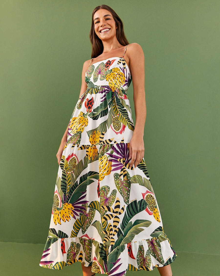 model wearing white midi sundress with vibrant forest leaf print