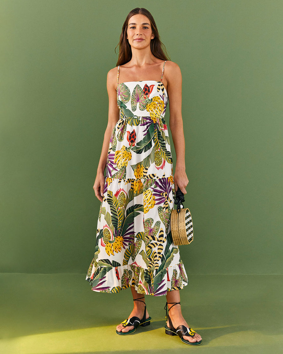 model wearing white midi sundress with vibrant forest leaf print