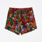 still image of scalloped hem shorts with black ground and all over multi wildflower print